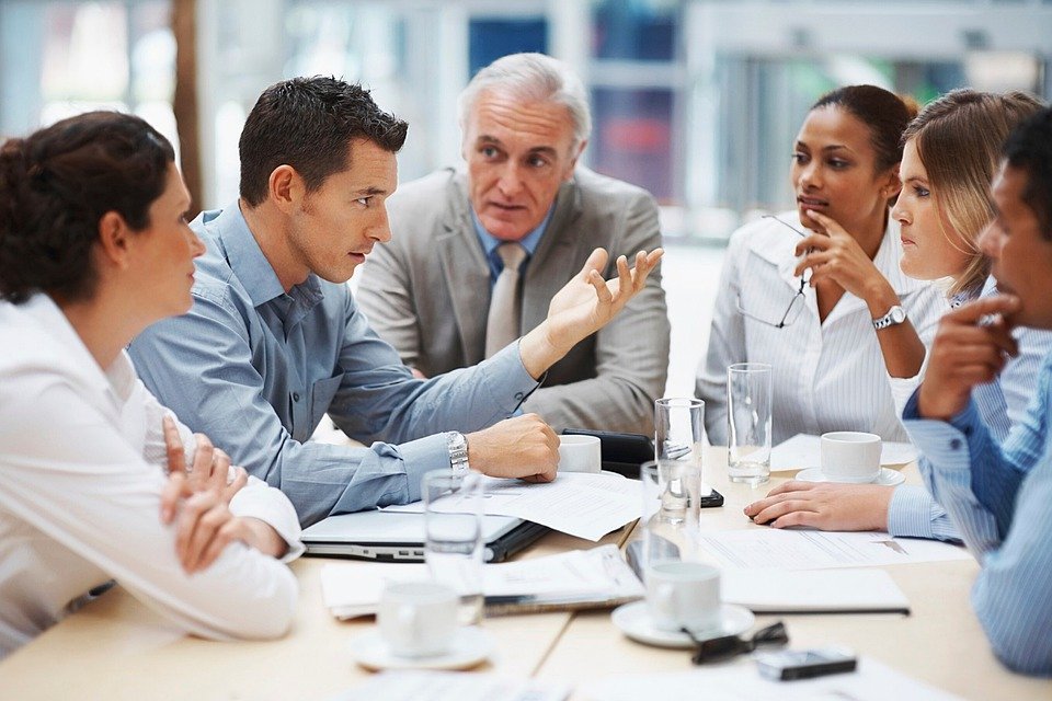 Leaders and employees listening to each other in a meeting